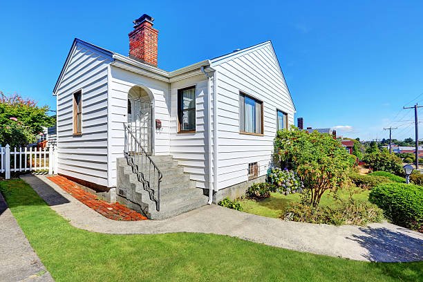 Cute small American house with white exterior paint. Northwest, USA