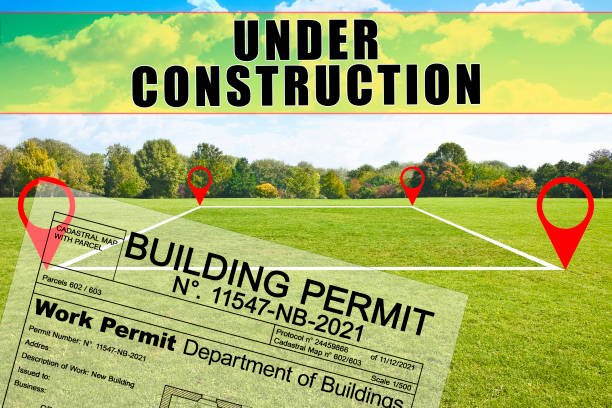 Buildings Permit with vacant land on a field with trees available for building under construction - note: the permit are totally invented