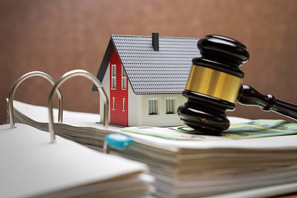 House, money and judgment – concept image of real estate law and financing