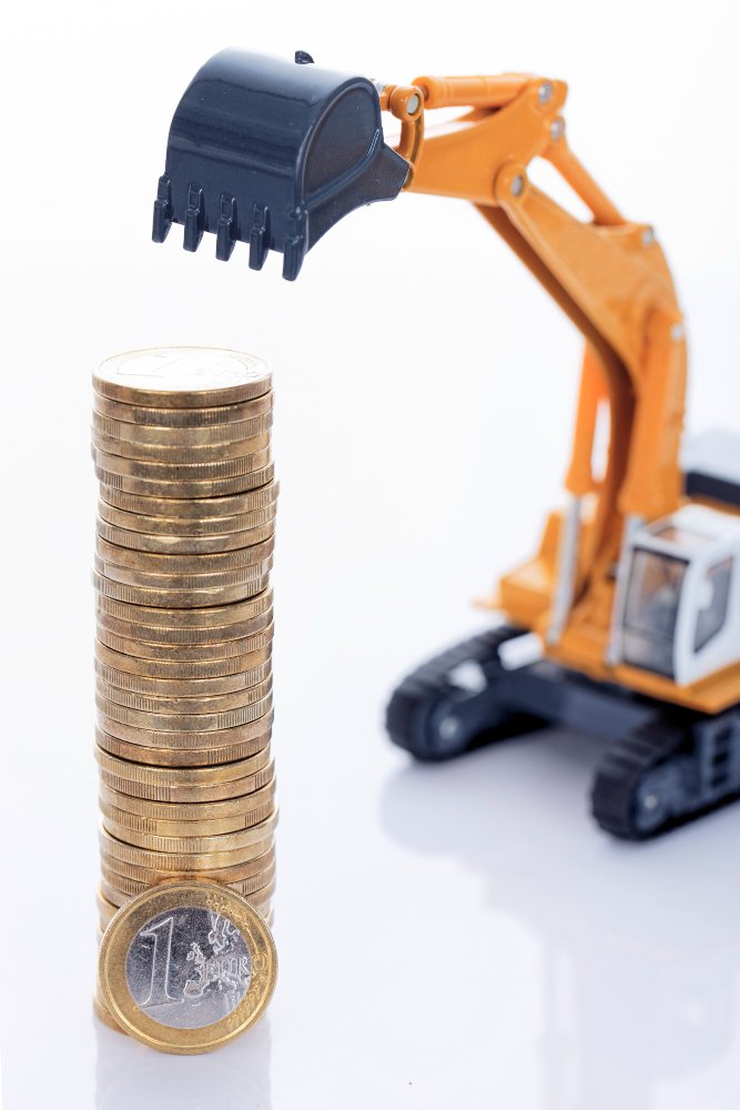 Euro money coins and digger isolated on white space 