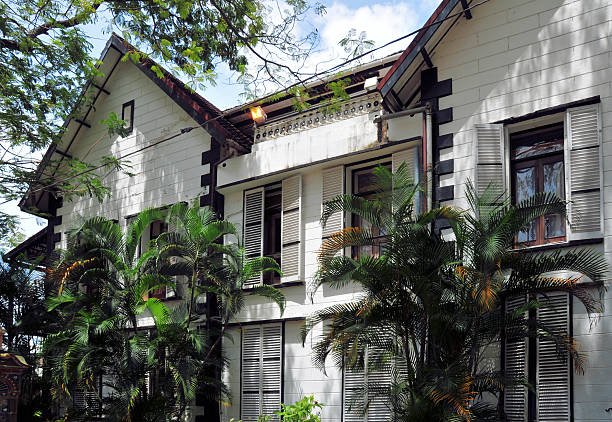 Victoria, Mahé Island, Seychelles: the former Supreme Court building in Victoria, Mahé, is recognized as the oldest masonry structure in the Seychelles. Constructed in 1885, it was originally commissioned by the New Oriental Bank Company to serve as its headquarters. Following the bank’s liquidation, the colonial government acquired the premises in 1892. In 1894, the upper floor was converted into the Judicial Department, housing the Judge’s Court and the Magistrate’s Court, while the ground floor accommodated the Treasury and Customs offices. The building served as the seat of the Supreme Court for over a century until judicial operations were relocated to the Palais de Justice. Extensively restored and reopened in 2018, it now houses the National Museum of History.